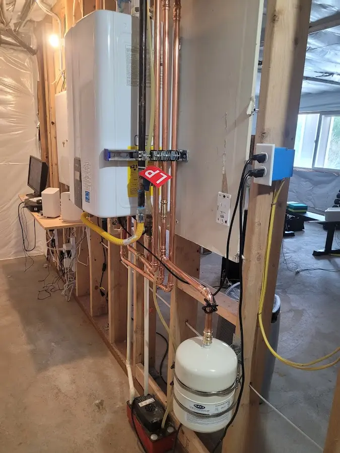 Licensed plumber repairing a kitchen sink in Burnet